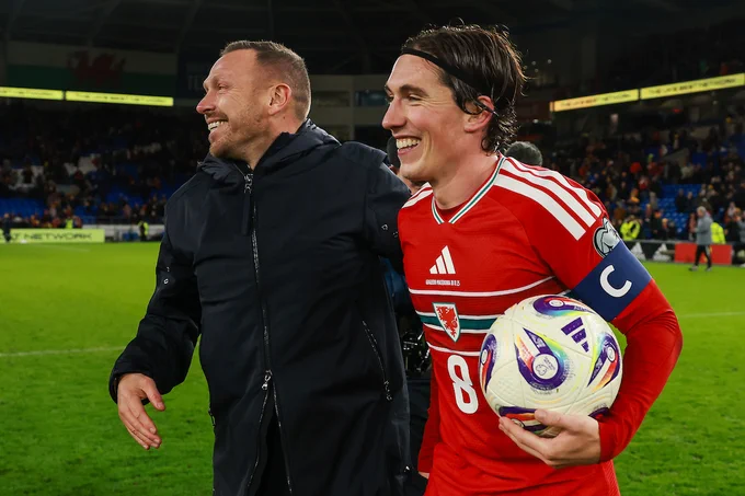 Craig Bellamy and Harry Wilson celebrate Cymru's 7-1 win over North Macedonia.