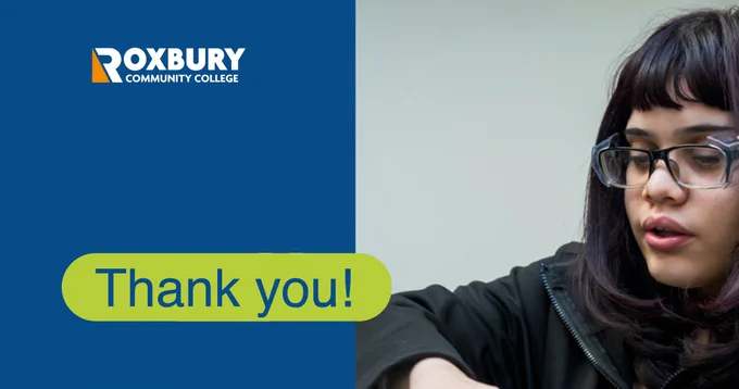 A cropped image of a Black woman wearing glasses, looking down and to the left. On the left is the Roxbury Community College logo and "Thank you!"