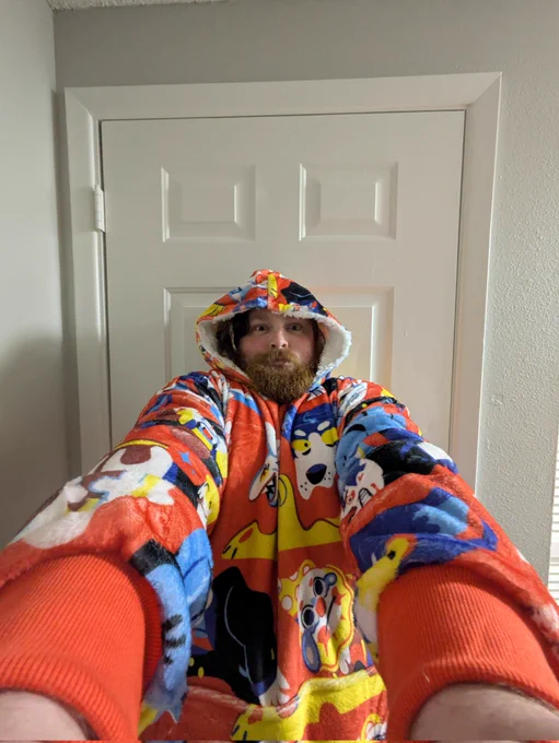 A totally normal selfie taken at more direct angle. It's actually not totally normal. I lied. I am in a hooded blanket. I zoomed the camera distance to .5 and slightly leaned back with both arms extended. It's distracting. This should be the new selfie standard. This was the first photo I took. I then moved to another room and took the others.