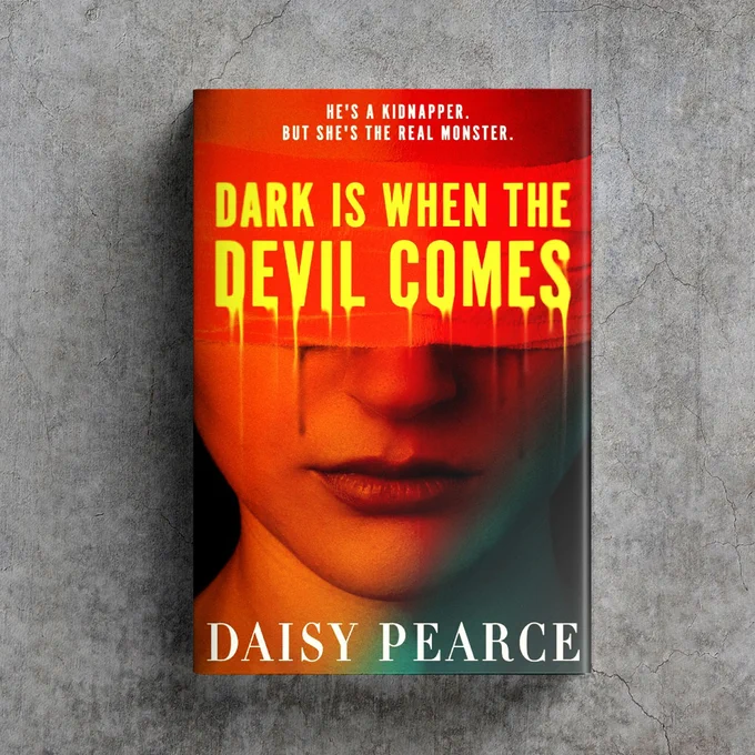 against a grey concrete background sits the hardback of Dark is When the Devil Comes