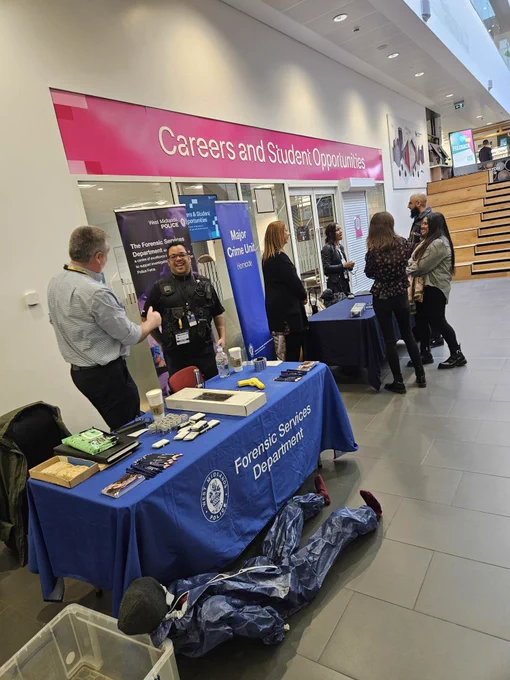 Forensic Services Department standing with their table at BCU