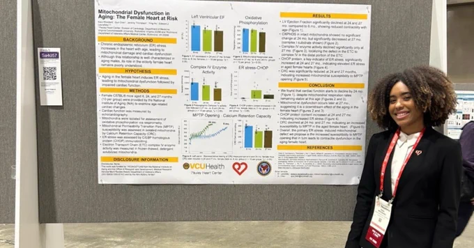 Pauley summer undergrad research fellow Kaia Woodard with her research poster at AHA 2025