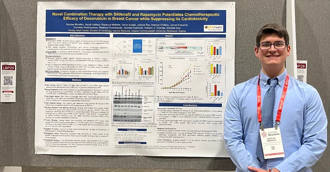 Pauley summer undergrad research fellow Nicolas Morales with his research poster at AHA 2025