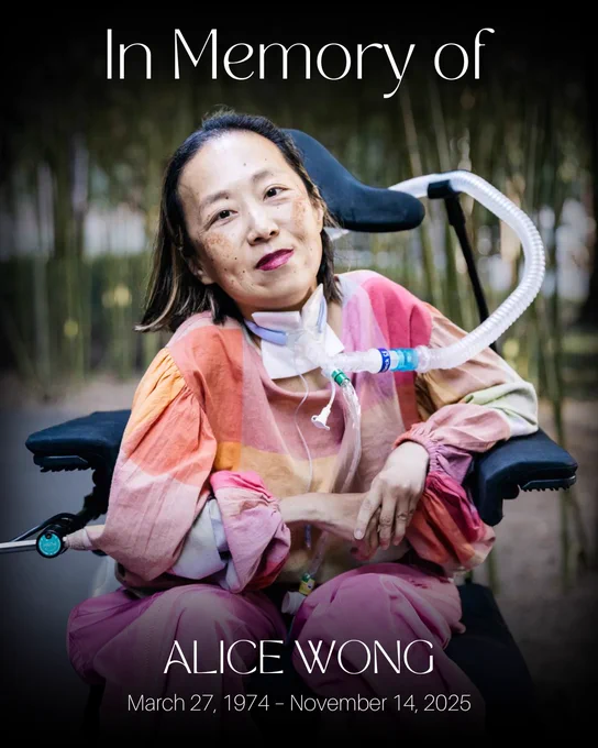 A memorial graphic with the text “In Memory of Alice Wong” and “March 27, 1974 – November 14, 2025.” The image shows a person seated in a power wheelchair, wearing a colorful, flowing top in warm tones and pink pants. A ventilator tube is connected near their neck. They are outdoors, surrounded by tall, softly blurred greenery, creating a calm and reflective atmosphere.