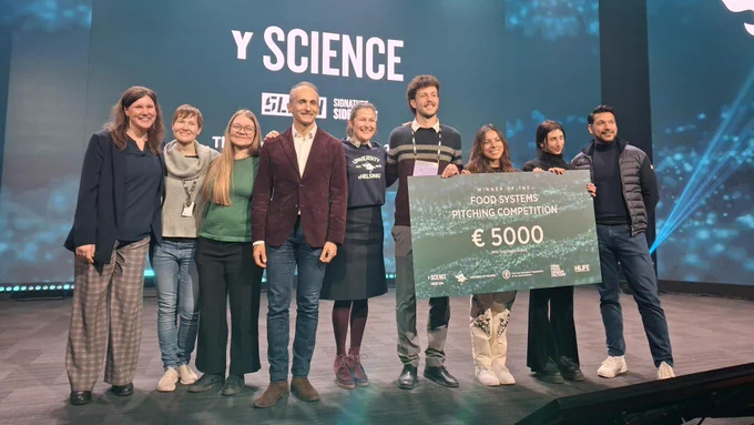 Photo of some of the Y Science Food Systems Pitching Competition and Data for Farm Value global challenge organizers, speakers, pitchers and jury on stage after the winner is announced.