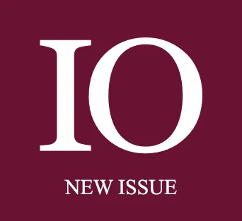 This image features the phrase "IO NEW ISSUE" in white text on a maroon background.
