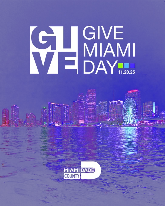 Give Miami Day 11.20.25, an event by Miami-Dade County, is advertised over a night-time cityscape featuring the Miami skyline across a body of water. A Ferris wheel is illuminated on the right side of the image.