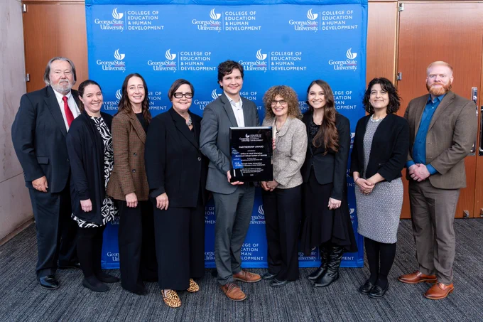 Representatives from the College of Education & Human Development's Adult Literacy Research Center and the Technical College System of Georgia’s Office of Adult Education pose for a group photo