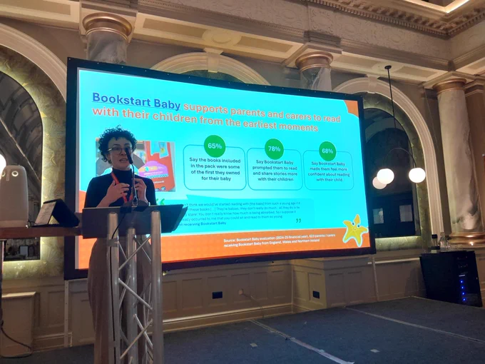 Lizzie presenting at the conference with a slide about Bookstart Baby
