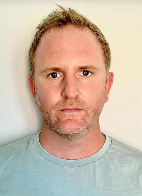 Photo of Tim looking at the camera