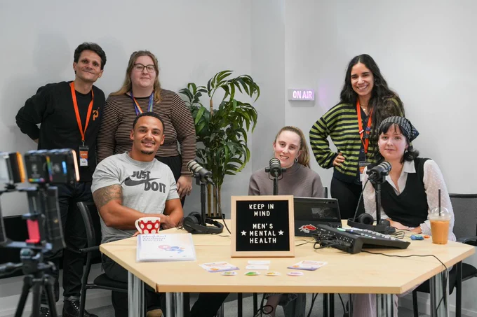 Group photo of Mind our Future Gwent project staff, peer service designers and Ashton Hewitt in the recording studio