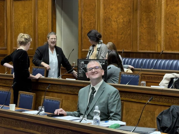 Eoin Kenny in the Assembly chamber at the disabled people’s Parliament.