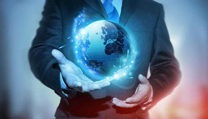 A business professional holding a glowing digital globe, symbolizing global expansion and multidomestic business strategy across international markets.