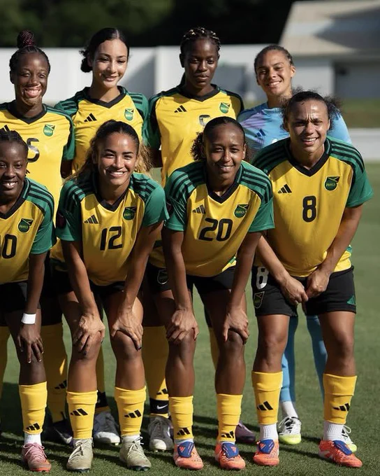 Atlanta Primus, wearing number 20, smiles in a team photo for Jamaica