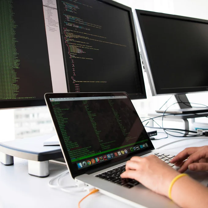 Hands on a laptop keyboard