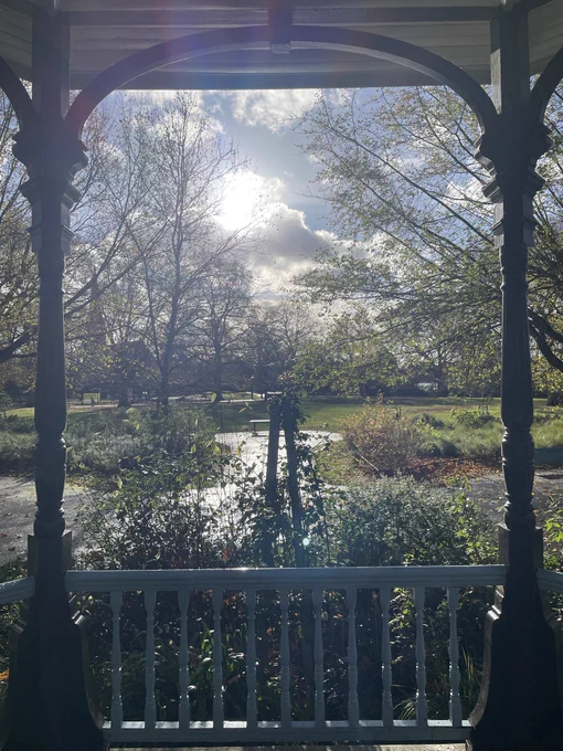 View from a bandstand across a sunlit park