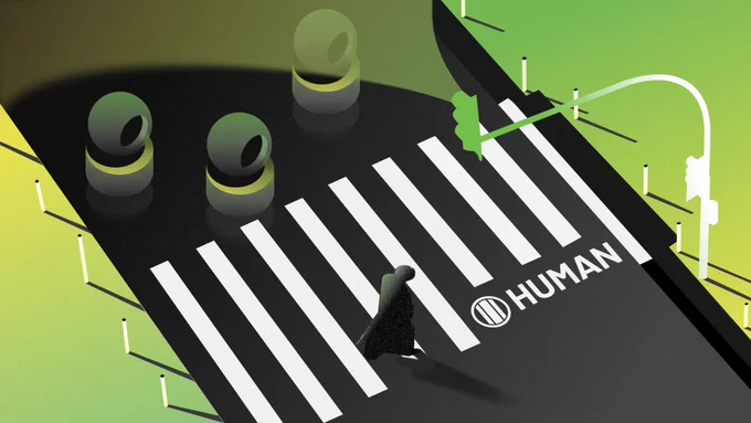 A stylized illustration of a person wearing a black cloak walking across a white-striped crosswalk. Above is a green traffic light, and to the side, three green circular objects. The word 'HUMAN' is printed on the road beneath the pedestrian.