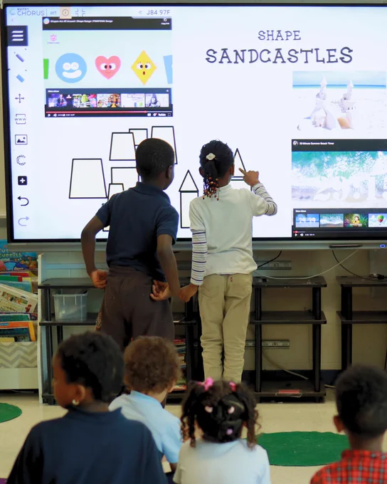 Clear Touch Elementary students using a smart board / interactive flat panel with manipulatives / shapes/ embed Youtube videos in front of classmates