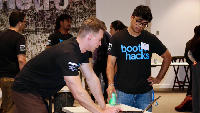 Students collaborating at BoothHacks