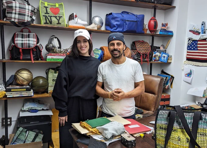 ANYBAG Founder Alex Dabagh and Founding Partner Kat Hoelck in the Dabagh family factory, Park Avenue International, when ANYBAGs are hand crafted in the heart of New York City. They upcycle plastic into sustainable fashion accessories and partner with global brands to make the next It Bag.