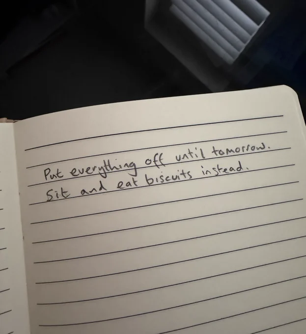Says “put every off until tomorrow. Sit and eat biscuits instead.”