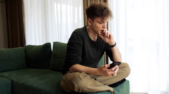 Person using their phone at home