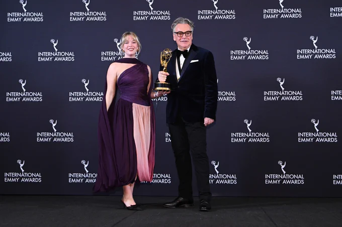 Anya Wilson and Kenton Allen holding their International Emmy trophy win for Ludwig
