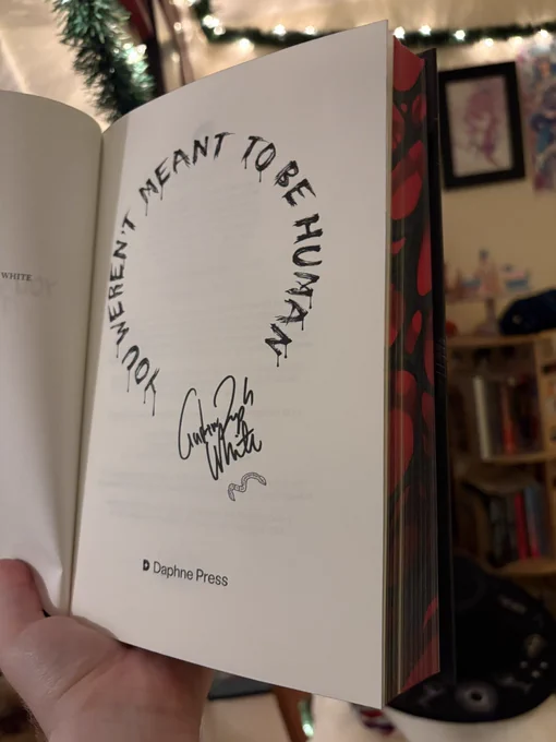 The signature page. The title is made of dripping letters in a circle, and the signature has a worm doodle on it.