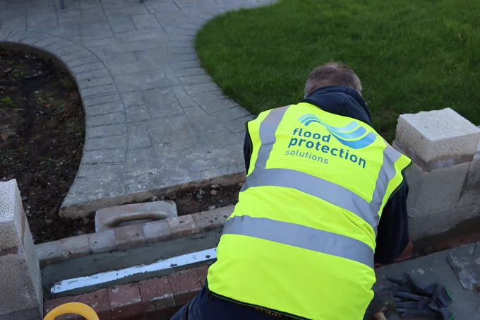 Flood Barrier installation into wall in garden
