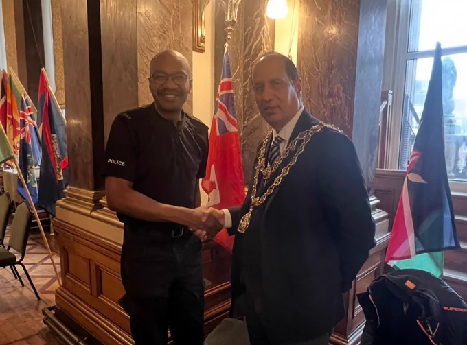 PC Brown shaking the hand of the Lord Mayor