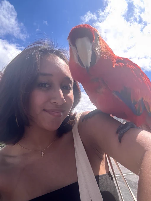 Ally Recalde with a parrot