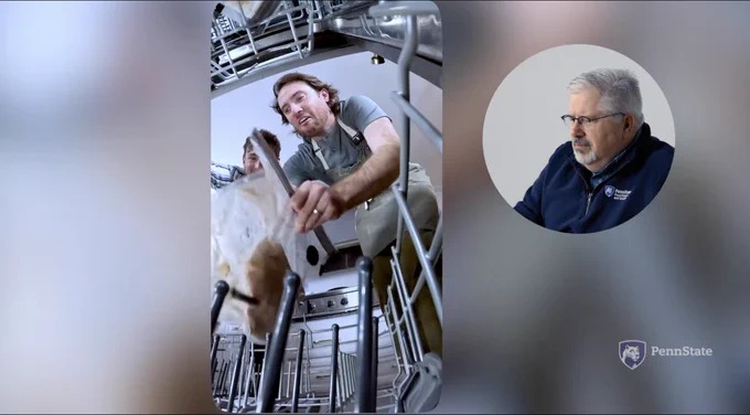 A concerned man watching two men try to cook a turkey in dishwasher.