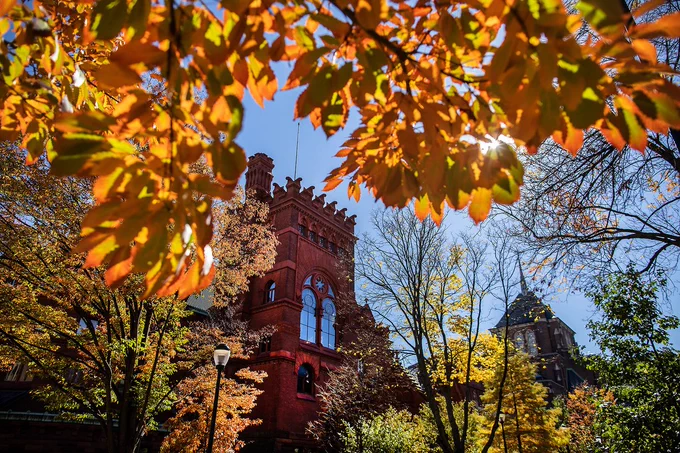 a red building on UPENN's campus photographed during the fall
 