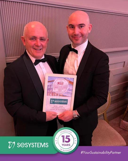 John O’Leary and Jake O’Connell from SE Systems stand together in formal black-tie attire, smiling and holding an award plaque celebrating SE Systems’ 15 years in business. The image includes a branded banner at the bottom with the SE Systems logo and a “15 Years” anniversary emblem.
