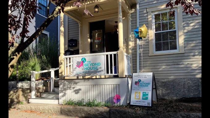 The main entrance to The Beyond House with "Beyond House" signage in front. 