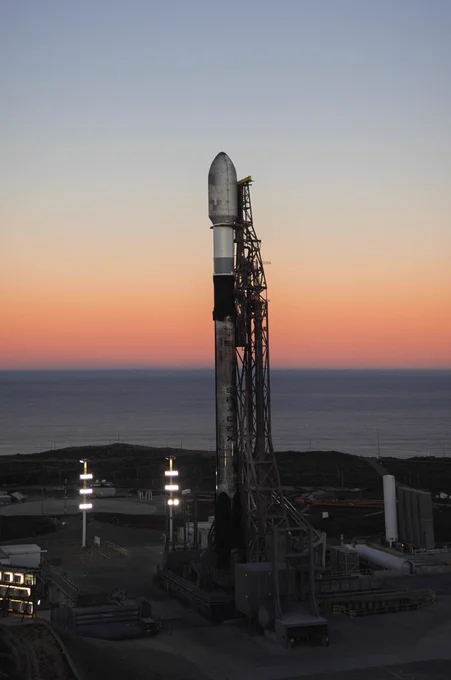 SpaceX Falcon 9 rocket on launch pad.
