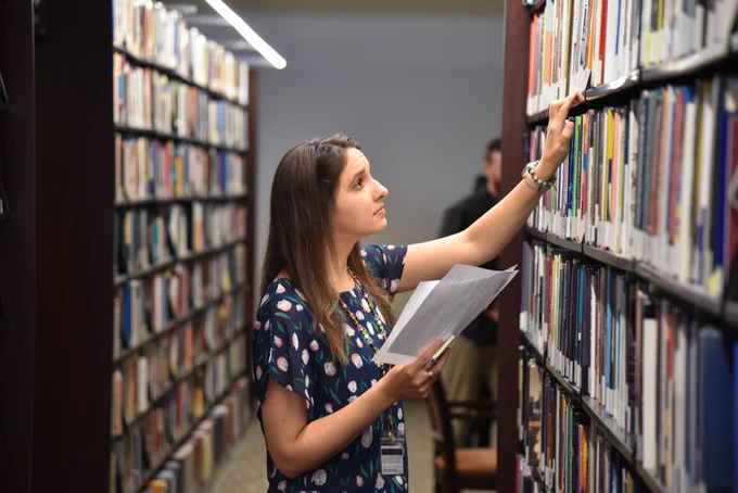 Librarian Amy Windham in the Payson stacks.