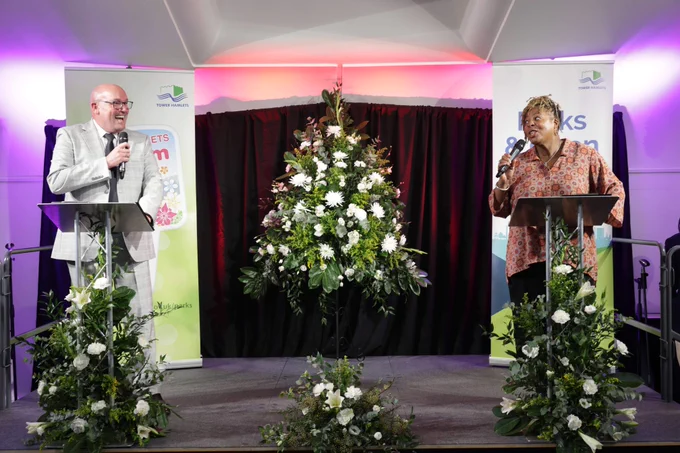 Victoria park managers on the stage with floral displays