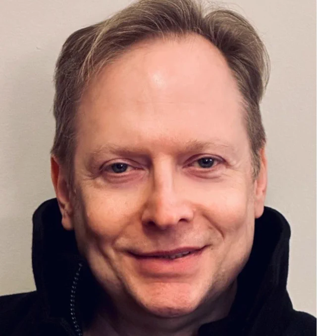 A headshot of Kurt Baumeister