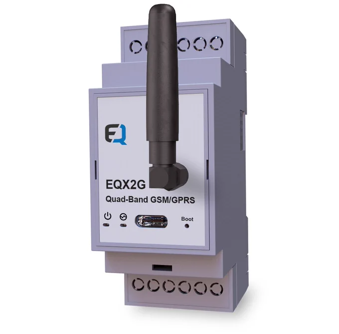 Image of the Erqos EQX2G quad-band GSM/GPRS expansion module mounted in a DIN-rail enclosure. The front panel shows the EQ logo, a prominent external antenna, status icons, a USB-C port, and a boot indicator. The module is designed to connect with the EQSP32 IoT Logic Controller to provide 2G cellular connectivity.