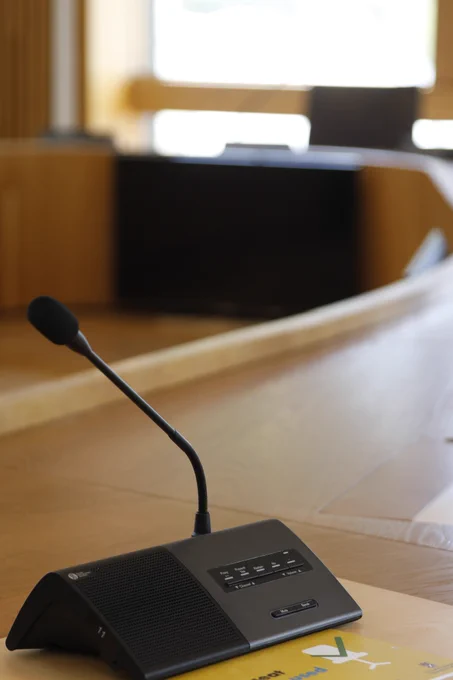 A microphone on a desk in a committee room at the Scottish Parliament
