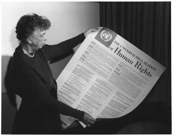 Photo: Eleanor Roosevelt holding poster of the Universal Declaration of Human Rights (in English), Lake Success, New York. November 1949. ©️ FDR Presidential Library & Museum https://www.flickr.com/photos/fdrlibrary/