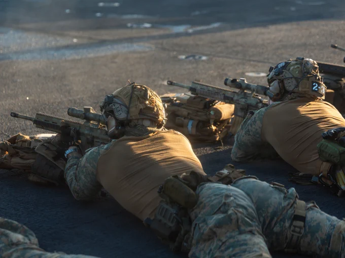 U.S. Marines with Maritime Special Purpose Force, 22nd Marine Expeditionary Unit (Special Operations Capable), engage targets during a deck shoot aboard Wasp-class amphibious assault ship USS Iwo Jima (LHD 7) while underway in the Caribbean Sea, Nov. 22, 2025. U.S. military forces are deployed to the Caribbean in support of the U.S. Southern Command mission, Department of War-directed operations, and the president’s priorities to disrupt illicit drug trafficking and protect the homeland. (U.S. Marine Corps photo by Sgt. Tanner Bernat)
