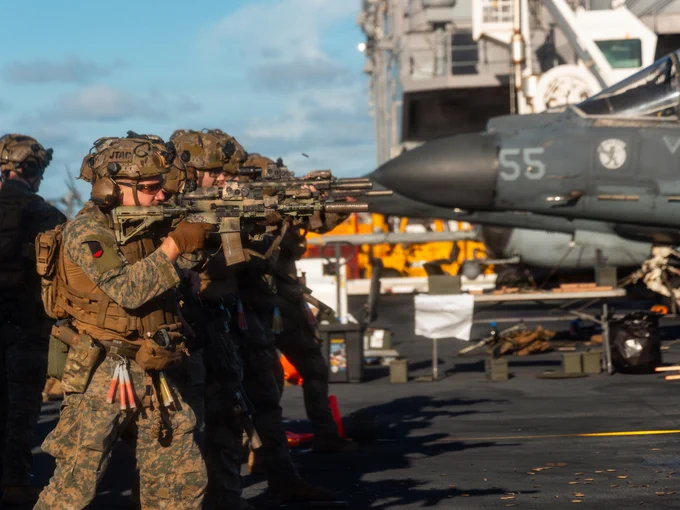 U.S. Marines with Maritime Special Purpose Force, 22nd Marine Expeditionary Unit (Special Operations Capable), engage targets during a deck shoot aboard Wasp-class amphibious assault ship USS Iwo Jima (LHD 7) while underway in the Caribbean Sea, Nov. 22, 2025. U.S. military forces are deployed to the Caribbean in support of the U.S. Southern Command mission, Department of War-directed operations, and the president’s priorities to disrupt illicit drug trafficking and protect the homeland. (U.S. Marine Corps photo by Sgt. Tanner Bernat)