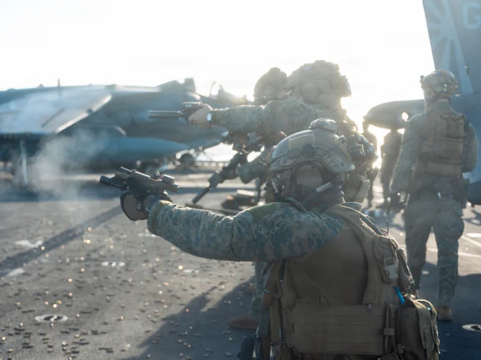 U.S. Marines with Maritime Special Purpose Force, 22nd Marine Expeditionary Unit (Special Operations Capable), engage targets during a deck shoot aboard Wasp-class amphibious assault ship USS Iwo Jima (LHD 7) while underway in the Caribbean Sea, Nov. 22, 2025. U.S. military forces are deployed to the Caribbean in support of the U.S. Southern Command mission, Department of War-directed operations, and the president’s priorities to disrupt illicit drug trafficking and protect the homeland. (U.S. Marine Corps photo by Sgt. Tanner Bernat)