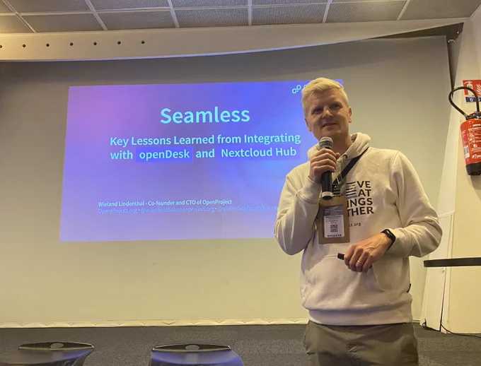Wieland Lindenthal presenting his talk on lessons learned from integrating with openDesk and Nextcloud Hub at OSXP 2025.