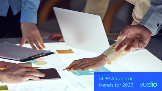 Photograph of a team planning together, with the title '14 PR & comms trends for 2026' overlaid with the Vuelio logo. 