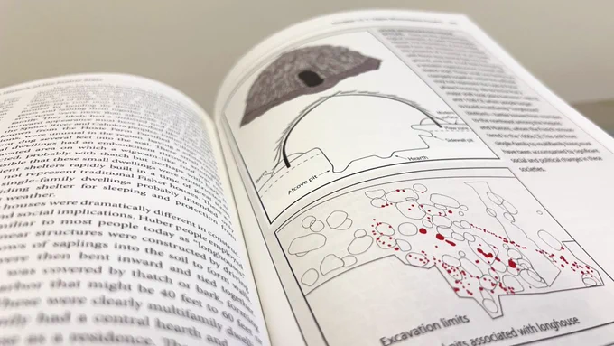 A close-up of the inside pages of the book showing text and diagrams of precolonial shelters.