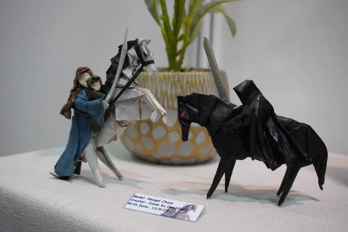 An origami recreation of Arwen (and Frodo) facing off against one of the Black Riders on horseback.