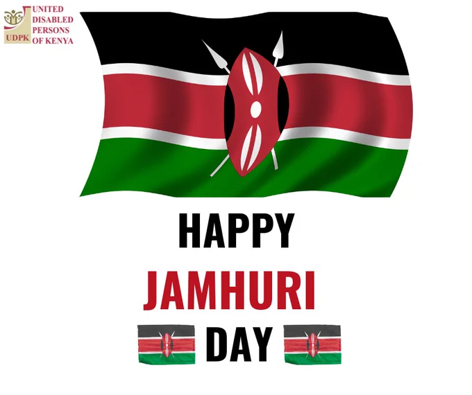 Graphic celebrating Jamhuri Day featuring a waving Kenyan flag in black, red, white, and green with a Maasai shield and spears at the center. The logo of United Disabled Persons of Kenya appears in the top left corner. Below the flag, bold text reads “Happy Jamhuri Day,” with small Kenyan flags placed on either side of the word “Day.”